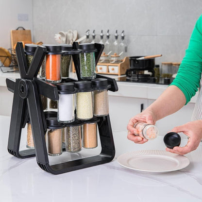 Black rotating spice rack on kitchen countertop - Souq Sama UAE